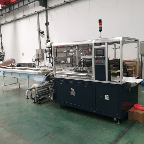 Film bottom feed packing machine